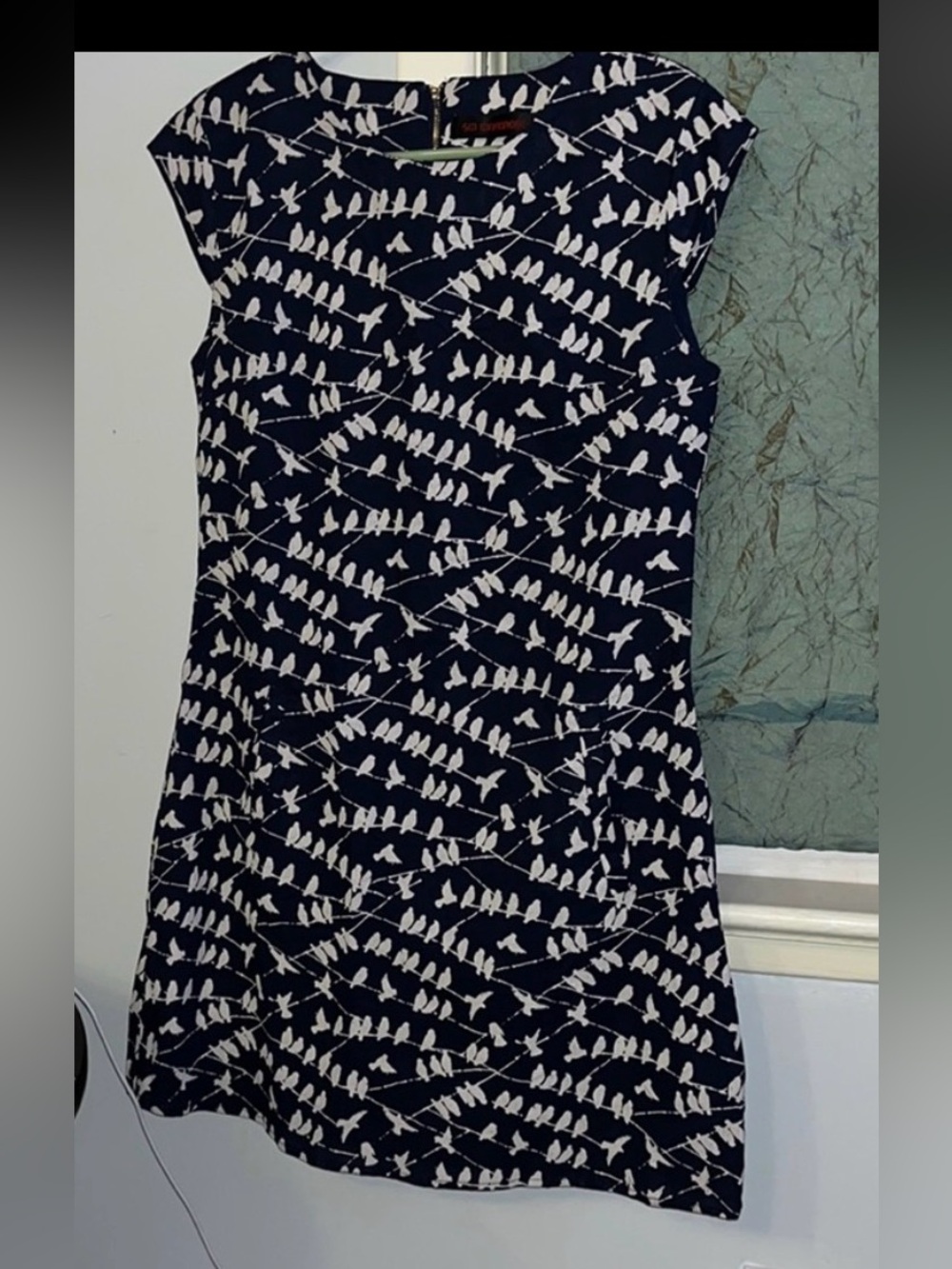 Boutique item. Never worn. beautiful, fully lined mini dress